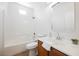 Well-lit bathroom with a clean white tiled shower, vanity and toilet at 909 Trinity Pond Cir, Henderson, NV 89002