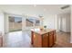 Eat-in kitchen featuring a center island, granite countertops, and stainless steel appliances at 909 Trinity Pond Cir, Henderson, NV 89002