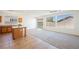 Open-concept kitchen and living room, large windows, and backyard access at 909 Trinity Pond Cir, Henderson, NV 89002
