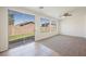 Bright and airy living area featuring sliding glass doors leading to the backyard patio at 909 Trinity Pond Cir, Henderson, NV 89002