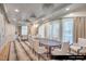 An airy card room featuring neutral tones, plush seating, and large windows for natural light at 9101 Alta Dr # 102, Las Vegas, NV 89145