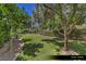 Beautifully manicured dog park with artificial turf, mature trees, and secure fencing at 9101 Alta Dr # 102, Las Vegas, NV 89145