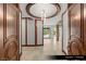 Elegant entry foyer featuring marble floors and ornate wooden trim at 9101 Alta Dr # 102, Las Vegas, NV 89145