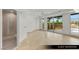 A neutral toned guest bedroom has an attached bath and multiple large windows at 9101 Alta Dr # 102, Las Vegas, NV 89145