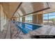 A long, bright indoor lap pool with large windows and marble accents at 9101 Alta Dr # 102, Las Vegas, NV 89145