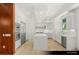 Modern kitchen with stainless steel appliances, a large island, and white cabinetry at 9101 Alta Dr # 102, Las Vegas, NV 89145