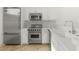 Bright kitchen featuring stainless steel Viking appliances and marble backsplash at 9101 Alta Dr # 102, Las Vegas, NV 89145