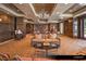 A refined library with dark wood paneling, a cozy seating area, and elegant lighting at 9101 Alta Dr # 102, Las Vegas, NV 89145