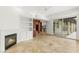 Open living room features fireplace, large windows, and neutral colors at 9101 Alta Dr # 102, Las Vegas, NV 89145
