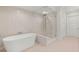 The main bathroom has a free standing tub and a separate glass shower at 9101 Alta Dr # 102, Las Vegas, NV 89145
