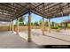Covered outdoor patio with decorative metalwork and landscaping, ideal for entertaining and relaxation at 9101 Alta Dr # 102, Las Vegas, NV 89145