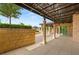 Expansive outdoor patio featuring custom stonework and a covered area for seamless indoor-outdoor living at 9101 Alta Dr # 102, Las Vegas, NV 89145