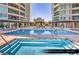 Resort-style outdoor pool and jacuzzi area with ample seating and stunning architectural features at 9101 Alta Dr # 102, Las Vegas, NV 89145