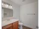 Bright bathroom featuring a modern vanity, neutral color palette, and a minimalist aesthetic at 929 Center St, Henderson, NV 89015