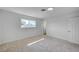 Bright bedroom features soft carpet, fresh paint, and natural light from the window at 929 Center St, Henderson, NV 89015