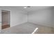 Minimalist bedroom with carpet flooring, sliding closet and ensuite bathroom at 929 Center St, Henderson, NV 89015