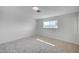 Bright bedroom with neutral carpet, white walls, and natural light from the window at 929 Center St, Henderson, NV 89015