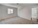 Bedroom features neutral carpet, white walls, and a closet with sliding doors at 929 Center St, Henderson, NV 89015