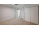 Bedroom with neutral carpet, white walls, closet with sliding doors and interior door at 929 Center St, Henderson, NV 89015