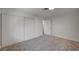 Bedroom with neutral carpet, white walls, closet with sliding doors and interior door at 929 Center St, Henderson, NV 89015