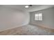 Bright bedroom with neutral carpet, white walls, and natural light from the window at 929 Center St, Henderson, NV 89015