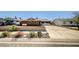 Charming single-story home with an expansive driveway, xeriscaping, and lush landscaping at 929 Center St, Henderson, NV 89015