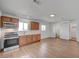 Open-concept kitchen showcases stainless appliances, wooden cabinets, and light countertops at 929 Center St, Henderson, NV 89015