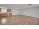Open-concept living room with gorgeous wood floors and seamlessly connected to the kitchen at 929 Center St, Henderson, NV 89015