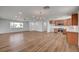 Open-concept living room with gorgeous wood floors and seamlessly connected to the kitchen at 929 Center St, Henderson, NV 89015