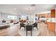 Bright living area featuring modern furnishings, light wood floors, and stainless kitchen appliances at 929 Center St, Henderson, NV 89015