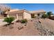 Inviting single-story home featuring a two-car garage and xeriscaped front yard at 945 Stetson Dr, Henderson, NV 89002