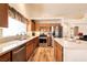 Well-lit kitchen boasts stainless steel appliances, wooden cabinets, and a modern design at 945 Stetson Dr, Henderson, NV 89002