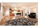 Spacious living room with wooden floors leading to an open-concept kitchen at 945 Stetson Dr, Henderson, NV 89002