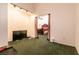 Empty room that opens into the bedroom featuring a carpeted floor at 945 Stetson Dr, Henderson, NV 89002