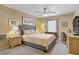 This is a stylish bedroom with a comfortable bed, two bedside tables, and artwork at 967 Cardelina Ln, Henderson, NV 89052