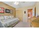 Bedroom features a ceiling fan, large closet, and neutral decor at 967 Cardelina Ln, Henderson, NV 89052