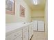 Convenient laundry room with plenty of counter space for folding and organizing your laundry at 967 Cardelina Ln, Henderson, NV 89052