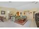 Bright living room with large sectional sofa and ample natural light, inviting you to relax at 967 Cardelina Ln, Henderson, NV 89052