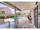Inviting covered patio with comfortable seating overlooks the sparkling swimming pool and lush backyard at 967 Cardelina Ln, Henderson, NV 89052