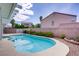 Sparkling swimming pool with a spa nestled in a private backyard setting with lush landscaping at 967 Cardelina Ln, Henderson, NV 89052