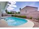 Sparkling swimming pool with a spa nestled in a private backyard setting with lush landscaping at 967 Cardelina Ln, Henderson, NV 89052