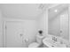 Bright bathroom with toilet, mirror and sink with white cabinets at 9714 Harper Edge St, Las Vegas, NV 89143