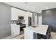 Modern kitchen with white cabinets, stainless steel appliances, and an island at 9714 Harper Edge St, Las Vegas, NV 89143