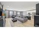 Spacious living room features a large sectional, modern fireplace, and stylish decor at 9714 Harper Edge St, Las Vegas, NV 89143
