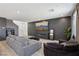 Spacious living room with a fireplace, large TV, and comfortable seating at 9714 Harper Edge St, Las Vegas, NV 89143