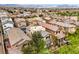 Expansive aerial view of a neighborhood with desert landscaping and stunning mountain backdrops at 10085 S Riley St, Las Vegas, NV 89178