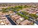 Aerial view of a neighborhood with neat landscaping and a desert landscape in the background at 10085 S Riley St, Las Vegas, NV 89178