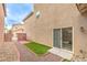 Charming backyard features a low-maintenance yard, private patio, and modern sliding glass doors at 10085 S Riley St, Las Vegas, NV 89178
