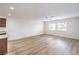 Bright open living space featuring wood floors, ceiling fan, and plenty of natural light at 10085 S Riley St, Las Vegas, NV 89178