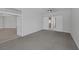 Large bedroom with gray carpet and entry to other rooms at 10113 Plomosa Pl, Las Vegas, NV 89134